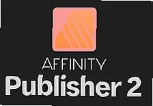 Designer reviews layout in portable publishing software on dual monitors, professional workspace setting